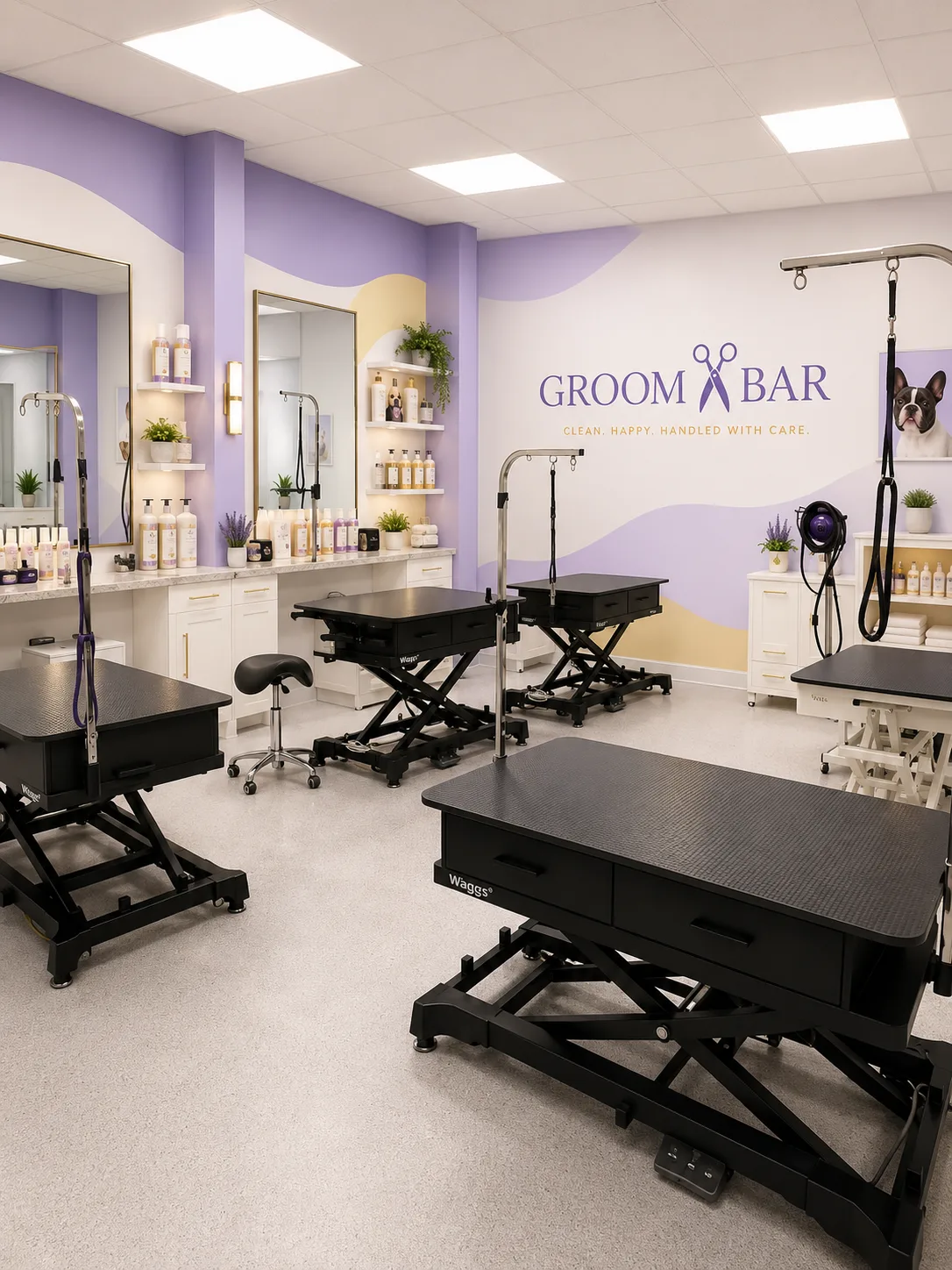 Groombar grooming room with multiple hydraulic tables and signature wave mural